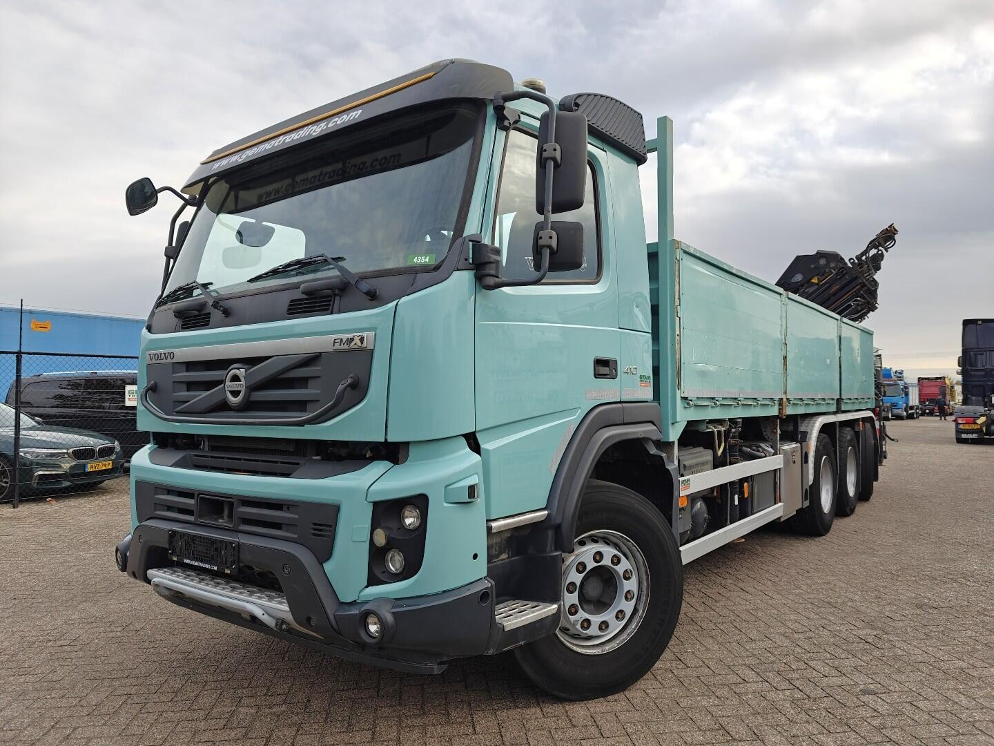 Volvo FMX 410 8x4/4 Dagcab Euro5 - Open Laadbak 6.8m + Hiab 244 E-6 Hipro - 258.000km - Naafreductie - 05/2026 APK | Vrachtwagens | Open laadbak